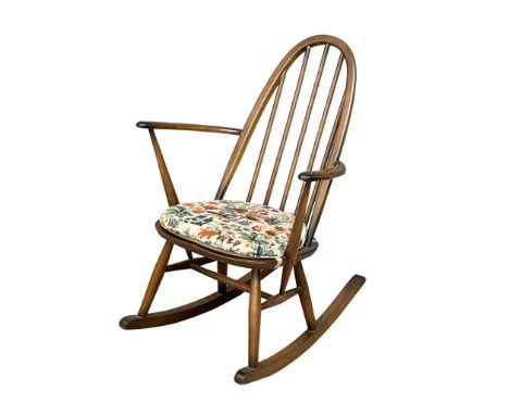 An Ercol Mid Century elm rocking chair. Model 428. 