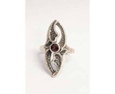 An ornate silver ring 