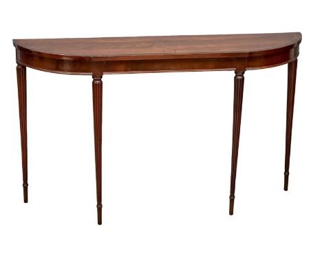 A Regency style inlaid mahogany console table with rosewood crossbanding on reeded legs. 123x30x72cm 