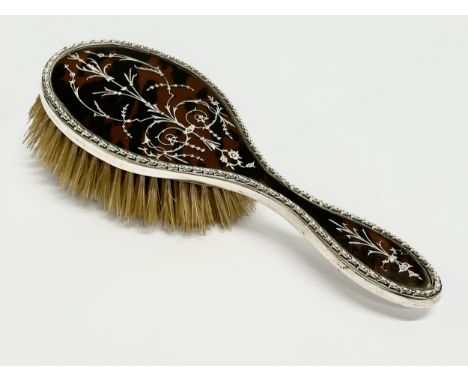 A silver and faux tortoise shell hair brush. London, 1916. 25cm 