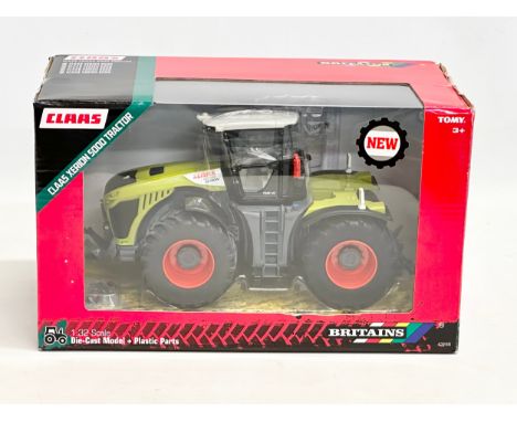 An unused Britains Claas Xerion 5000 Tractor in box. 1:32 scale. Die-Cast Model and Plastic Parts. 29x15x17cm 