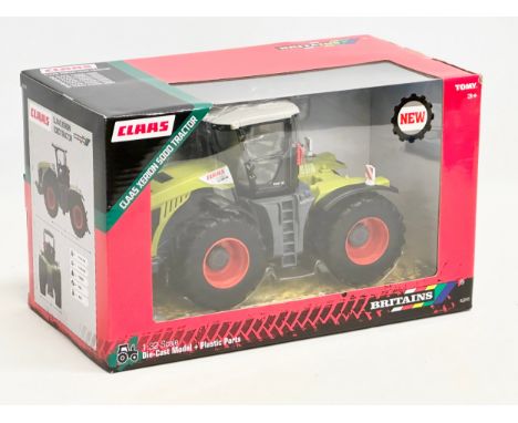 An unused Britains Claas Xerion 5000 Tractor in box. Die-Cast Model and Plastic Parts. 29x15x17cm 