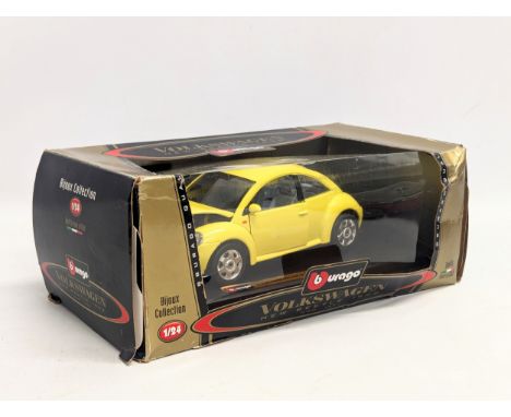 A Burago Bijoux Collection 'Volkswagen New Beetle 1998," in box. 1/24 scale. 