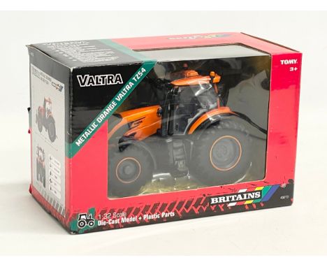 An unused Britains Valtra Metallic Orange Valtra TZ54 Tractor in box. 1:32 scale. Die Cast Model and Plastic Parts. 22.5x12x1