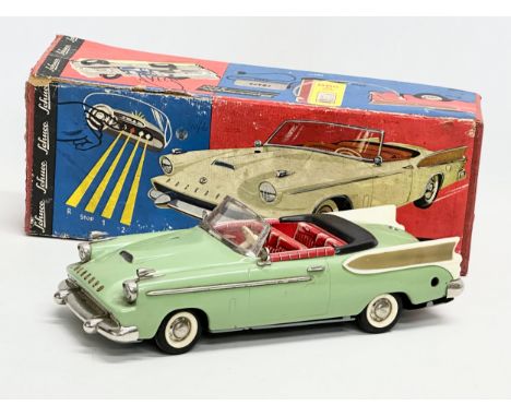 A vintage Schuco Electro Synchromatic 5700 model car with original box. West Germany. Car measures 27cm 