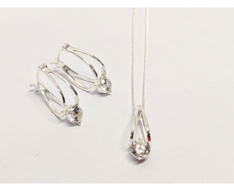 A silver necklace and earring set 