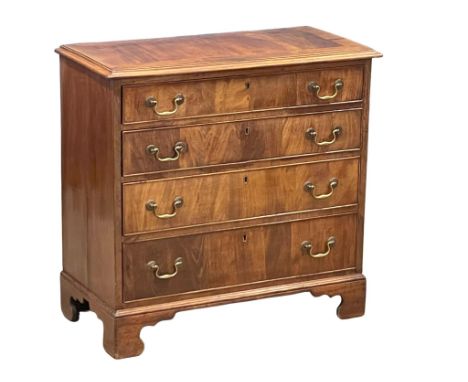A fine proportioned early George III mahogany oak lined chest of drawers with original brass drop handles on bracket feet. Ci