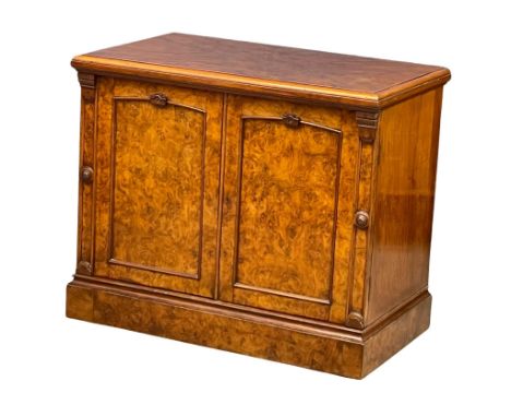 A Victorian Burr Walnut double door side cabinet with Rosette mouldings and interior shelf. 91.5x55x76.5cm 