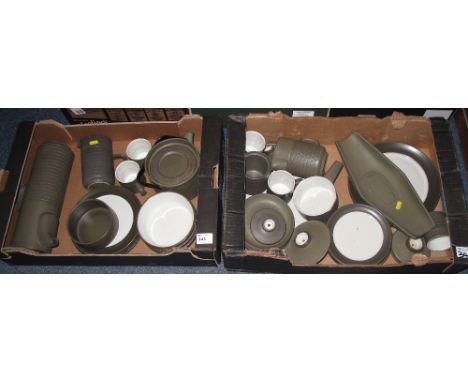 Two trays of Denby stone ware items comprising, cylinder coffee pot, coffee cans and saucers, various plates, bowls, dish etc