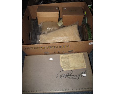 Box of assorted items to include gas masks in original boxes, vintage tins, land army socks, other fabrics, feathered stole e