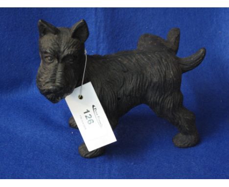 Cast metal Scottie dog "cocking his leg" door stop.