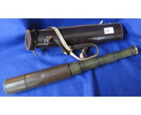 A Broadhurst Clarkson and Company Limited brass four drawer military telescope with leather cover and leather carrying cylind