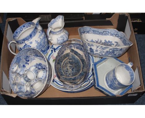 Tray of assorted blue and white china to include; 19th Century baluster jug depicting oriental scenes, egg cups, pedestal bow