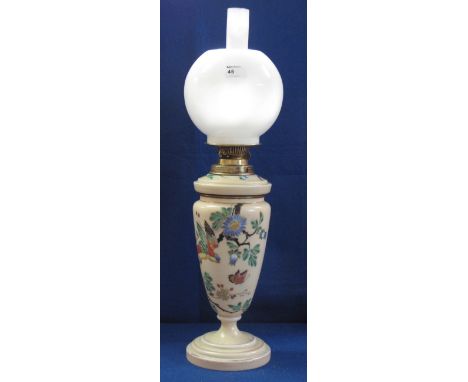 Early 20th Century brass double burner oil lamp with floral painted ceramic reservoir and vase shaped base on a circular foot