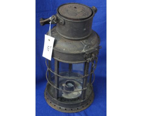 Black finish metal candle lantern with glazed sides and swing handle.