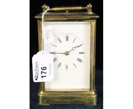 French brass carriage clock with swing handle and full depth enamel dial having normal numerals, the movement striking on one