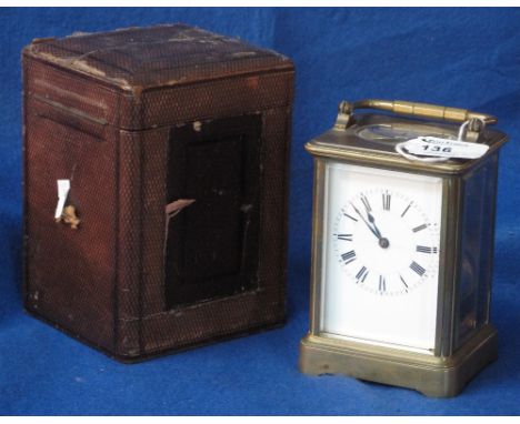 French brass carriage clock with full depth enamel face having Roman numerals, two train movement striking on one gong, toget