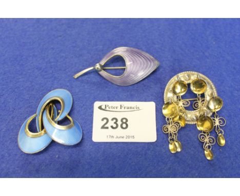 Three Norwegian brooches, two with enamel, two marked: 925, one marked: 830. CONDITION REPORT: Minor surface wear.
Enamel in 