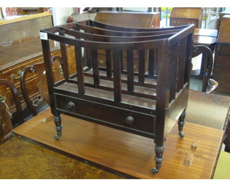 19th Century mahogany music canterbury on turned tapering legs with brass cups and castors. 