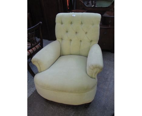 Late 19th/early 20th Century button back upholstered bedroom armchair on ring turned legs and castors.