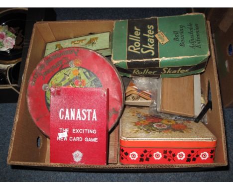 Box of assorted items to include vintage table tennis set, Rollfast roller skates in original box, Canasta the exciting new c