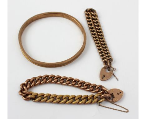 A 9ct rose gold engine turned decorated bangle, diameter 8cm and two yellow metal bracelets, approx weighable 12.7g (3).