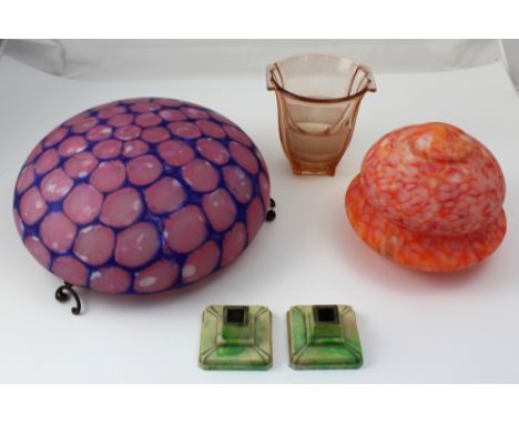 An Art Deco mottled pink and blue pendant glass lamp shade, a smaller mottled orange example, a peach moulded glass two-handl