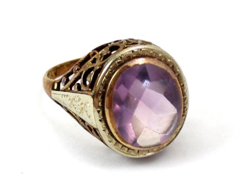 A 10ct gold ladies' dress ring set with oval facet-cut amethyst to filigree shoulders, size L, approx 4.1g. CONDITION REPORT 