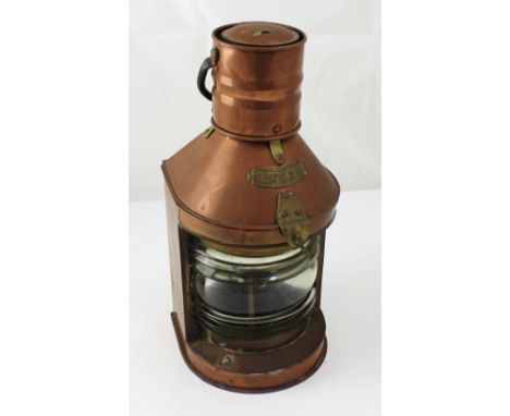 A copper and brass ship's stern lamp, height 44cm.