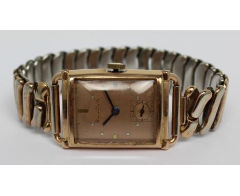 Bulova; a 1949 gentlemen's 'Craftsman' tank-style wristwatch, rose gold filled rectangular case with matching ping gold fille