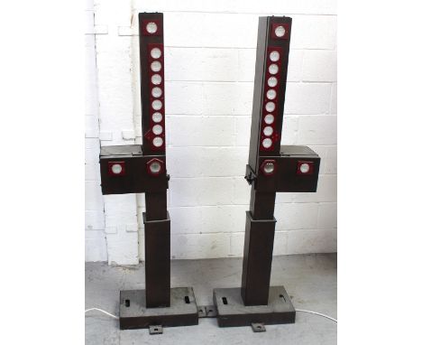 Two metal lighting units, height of each 155cm (2).