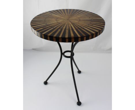 A small circular ebonised and bamboo occasional table on black metal tripod base, 53 x 40cm.