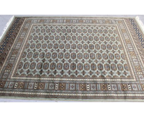 A modern green ground Bokhara carpet, 230 x 160cm
