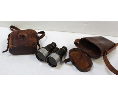 A leather-cased pair of Ross of London military binoculars, both binoculars and case with broad arrow mark and numbered 1905 