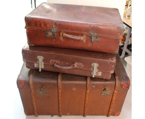 An Edwardian travel trunk with wood binding initialled J.R.M., length 92cm and two vintage brown suitcases (3).
