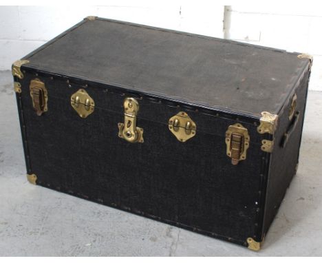 A contemporary travel trunk with brass fastenings, length 88cm.