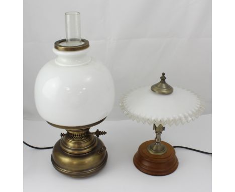 A retro electric table lamp in the form of and old paraffin lamp and a smaller electric table lamp with frilled glass shade, 