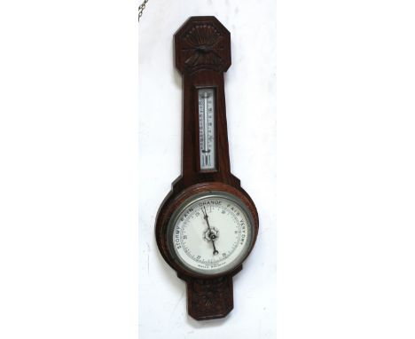 An oak wall-hanging barometer and thermometer, length 63cm.