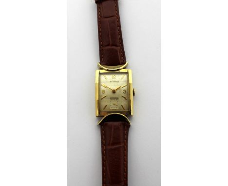 Wittnauer; a 1940s gentlemen's Art Deco tank-style watch, gold filled case with 'half-moon' lugs and faceted crystal, the whi