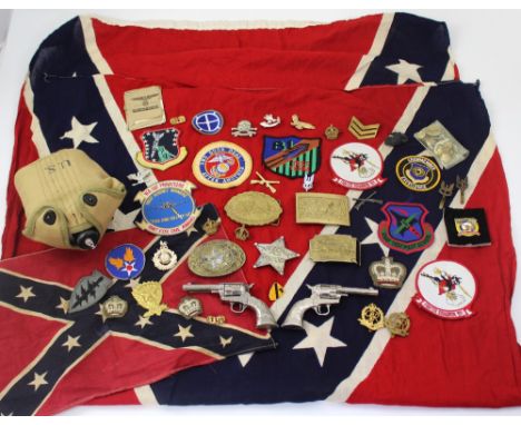 A small quantity of reproduction militaria including Confederate flag, US Army flask, cloth and cap badges, a pair of toy Col