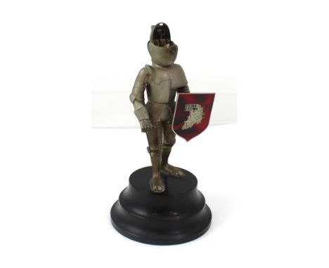 A vintage table lighter in the form of a knight in armour.