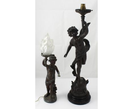 A spelt figural lamp base after Auguste Moreau in the form of a putto, height 70cm and a further example (2).   CONDITION REP