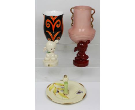 An Emma Bailey Art Deco style vase, a pink Carlton Ware Art Deco vase, a pair of Carlton Ware Mabel Lucy Attwell dog figures 