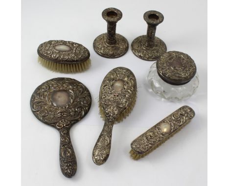 An Elizabeth II hallmarked silver dressing table set to include two gentlemen's brushes, ladies hair brush, mirror, trinket p
