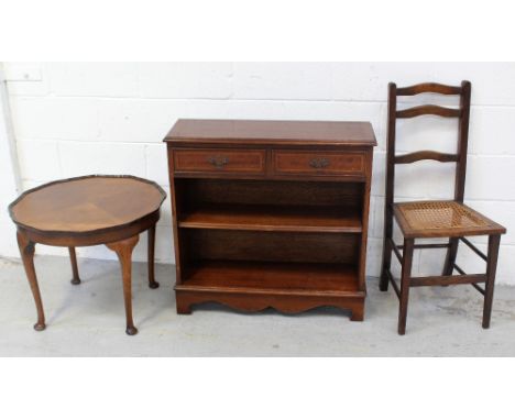 An Edwardian-style oak circular side table with piecrust rim to cabriole supports, a reproduction mahogany bookcase, two frie