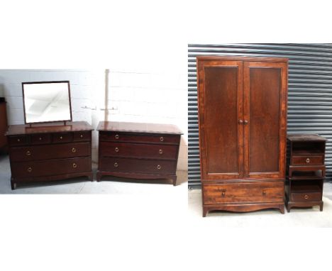 A retro Stag bedroom suite comprising a two-door wardrobe, height 199cm, width 106cm, two matching bedside cabinets, a chest 