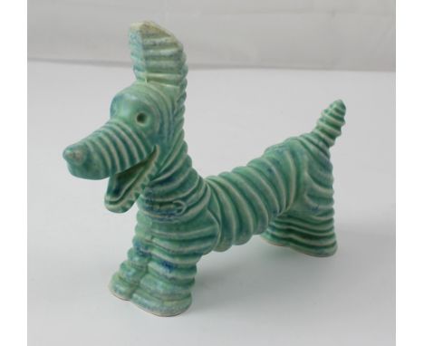 A Carlton ware comical dog with ribbed finish, length approx 19cm. CONDITION REPORT There are no obvious signs of significant