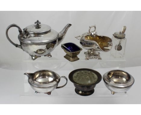 A 1930s silver plated Britannia metal three-piece tea service comprising teapot, milk jug and sugar bowl, also a scuttle-shap