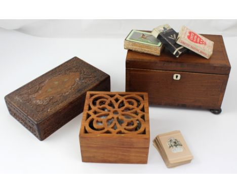 A 19th century mahogany tea caddy on bun supports, an Indian Kashmiri carved box and a contemporary potpourri box with pierce