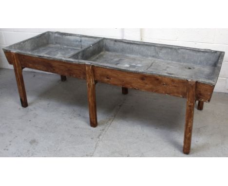 A pine and lead-lined two-section trough with plug holes, length 207cm.